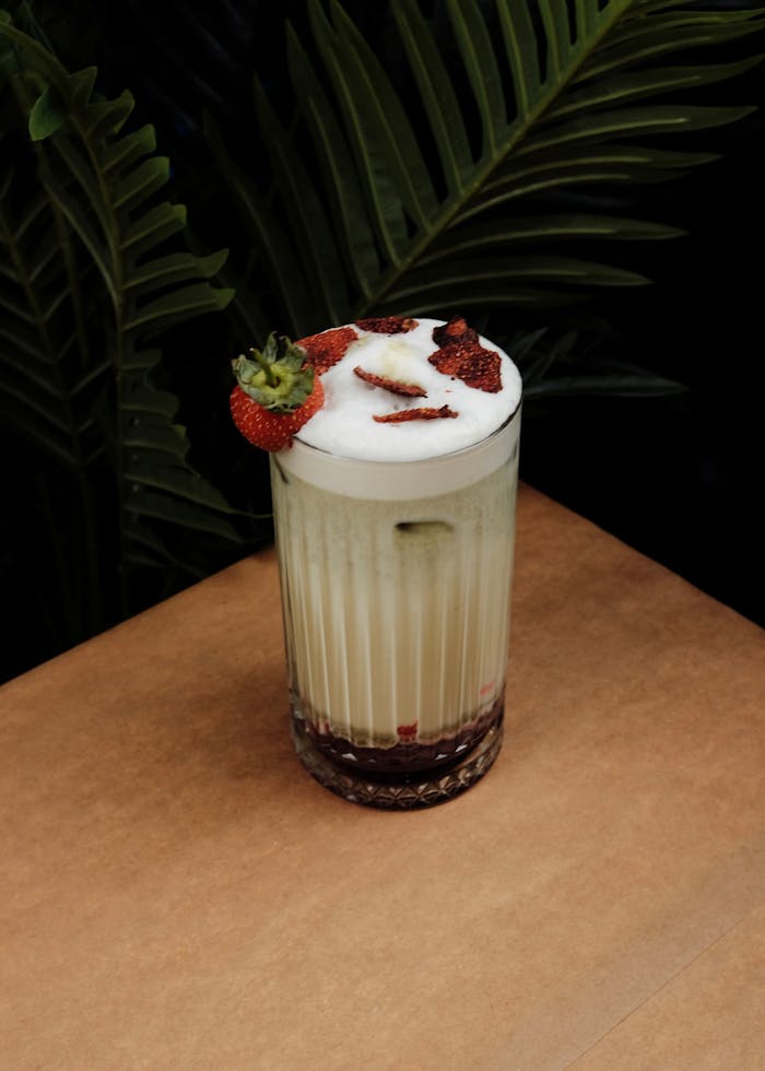 Delicious creamy milkshake with strawberries, perfect for refreshing treats.
